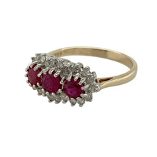 Load image into Gallery viewer, Add romantic colour and vintage-inspired brilliance to your collection with this pre-owned 9ct yellow gold diamond and ruby set trilogy cluster ring—elegant, symbolic, and rich in detail.

Design: The ring features a trilogy of ruby stones with the centre ruby measuring 5mm in diameter and two 4mm rubies on either side. Each stone is surrounded by sparkling diamonds in a cluster setting, enhancing the deep red tones and creating a classic, eye-catching look.

