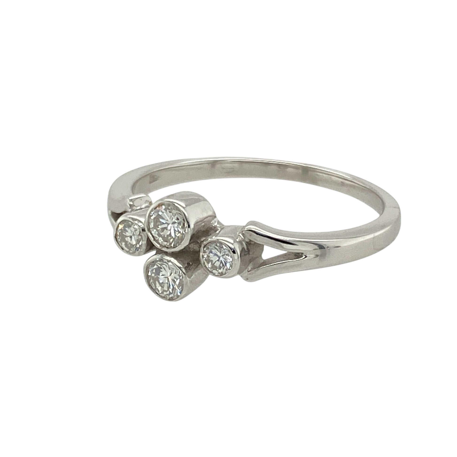 Add sleek sophistication and timeless sparkle to your collection with this pre-owned 18ct white gold diamond rubover set ring—elegant, modern, and full of refined detail.

Design: The ring features four brilliant cut diamonds set closely together in a clean rubover setting, framed by split shoulders that enhance the design’s flow and structure. The total diamond content is approximately 0.30ct.
