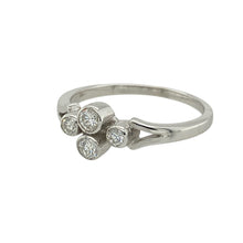 Load image into Gallery viewer, Add sleek sophistication and timeless sparkle to your collection with this pre-owned 18ct white gold diamond rubover set ring—elegant, modern, and full of refined detail.

Design: The ring features four brilliant cut diamonds set closely together in a clean rubover setting, framed by split shoulders that enhance the design’s flow and structure. The total diamond content is approximately 0.30ct.


