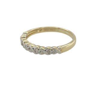 Add charming detail and subtle sparkle to your collection with this pre-owned 9ct yellow gold diamond set band ring—elegant, romantic, and perfect for everyday wear.

Design: The 3mm wide band features diamonds set between white gold kiss 'X' symbols, creating a unique and meaningful pattern with a touch of brilliance.
Material: Made from 9-carat yellow gold with white gold accents, the polished finish enhances the contrast and highlights the delicate sparkle of the diamonds.
