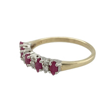 Load image into Gallery viewer, Bring rich colour and classic sparkle to your collection with this pre-owned 9ct yellow gold band ring, featuring vivid marquise-cut rubies and sparkling diamonds—perfect for timeless elegance with a touch of romance.

Design: The ring features marquise-cut ruby stones, each measuring approximately 4mm by 2mm, arranged along the band with two brilliant-cut diamonds delicately set in between. The alternating pattern creates a balanced and refined design.

