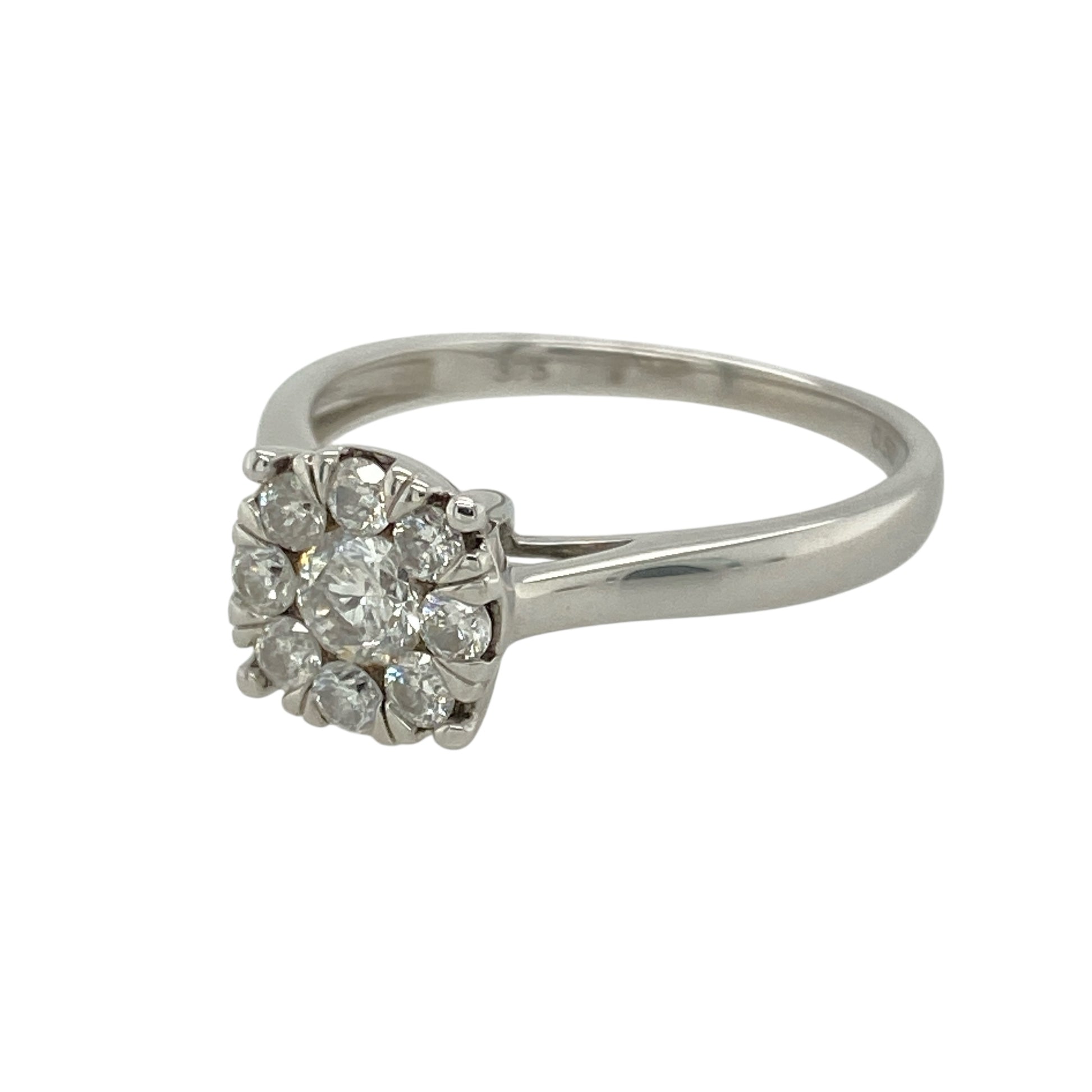 Bring radiant sparkle and elegant design to your collection with this pre-owned 9ct white gold illusion set cluster solitaire ring, featuring a striking diamond arrangement—perfect for special occasions or timeless everyday style.

Design: The ring features an illusion set cluster designed to resemble a larger single diamond, creating maximum brilliance and impact. With approximately 0.50ct of total diamond content, the clustered stones form a dazzling focal point with classic solitaire appeal.
