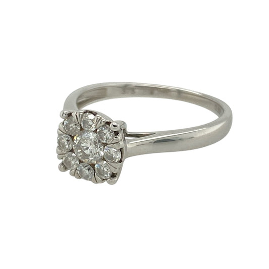 Bring radiant sparkle and elegant design to your collection with this pre-owned 9ct white gold illusion set cluster solitaire ring, featuring a striking diamond arrangement—perfect for special occasions or timeless everyday style.

Design: The ring features an illusion set cluster designed to resemble a larger single diamond, creating maximum brilliance and impact. With approximately 0.50ct of total diamond content, the clustered stones form a dazzling focal point with classic solitaire appeal.
