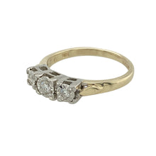 Load image into Gallery viewer, Bring classic symbolism and refined sparkle to your collection with this pre-owned 9ct yellow gold trilogy ring, featuring three brilliant-cut diamonds—perfect for marking meaningful moments or adding timeless elegance to everyday wear.

Design: The ring features a traditional trilogy design with three diamonds representing the past, present, and future. The total diamond content is approximately 0.10ct, offering delicate brilliance with a touch of sentiment within an illusion setting.

