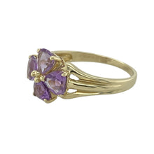 Load image into Gallery viewer, Bring romantic charm and vibrant colour to your collection with this pre-owned 9ct yellow gold flower ring, featuring heart-shaped amethysts in a delicate floral design—perfect for adding a touch of sweetness and sparkle to any look.

Design: The ring showcases four heart-shaped amethyst stones, each approximately 5mm in diameter, arranged in a floral pattern that creates a soft, elegant silhouette.

