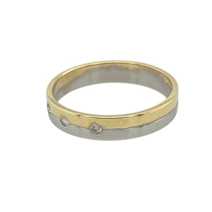 Bring modern contrast and subtle sparkle to your collection with this pre-owned 18ct yellow and white gold band ring, featuring a two-tone design and diamond accents—perfect for understated elegance with a contemporary edge.

Design: The band is set with three small brilliant-cut diamonds spaced across the top, offering a touch of sparkle. The ring features a yellow gold upper section and a white gold underside, creating a sleek, two-tone look.
