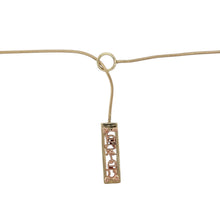 Load image into Gallery viewer, Bring heartfelt elegance and meaningful design to your collection with this pre-owned 9ct yellow and rose gold Clogau Cariad lariat necklace, combining Welsh heritage with timeless sentiment—perfect for everyday wear or gifting with love.

Design: The lariat-style necklace features a sleek pendant measuring 21mm by 6mm, engraved with “Cariad”—the Welsh word for ‘beloved’. The design blends yellow and rose gold elements in a graceful drop, offering both symbolism and style.

