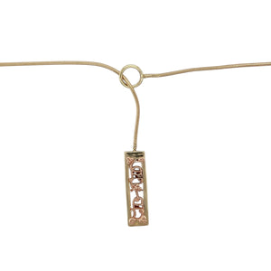 Bring heartfelt elegance and meaningful design to your collection with this pre-owned 9ct yellow and rose gold Clogau Cariad lariat necklace, combining Welsh heritage with timeless sentiment—perfect for everyday wear or gifting with love.

Design: The lariat-style necklace features a sleek pendant measuring 21mm by 6mm, engraved with “Cariad”—the Welsh word for ‘beloved’. The design blends yellow and rose gold elements in a graceful drop, offering both symbolism and style.
