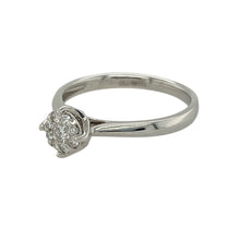 Load image into Gallery viewer, Bring refined sparkle and timeless style to your collection with this pre-owned 9ct white gold illusion set cluster solitaire ring, offering a classic look with enhanced brilliance—perfect for elegant everyday wear or special occasions.

Design: The ring features a cluster of brilliant cut diamonds illusion set to resemble a larger solitaire, with approximately 0.16ct of total diamond content. The setting enhances the appearance of size and sparkle while maintaining a refined silhouette.

