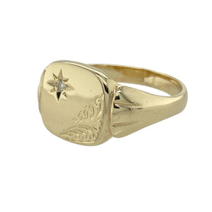 Add vintage flair and a hint of sparkle to your collection with this pre-owned 9ct yellow gold and diamond starburst signet ring—perfect for bold style with classic detailing.

Design: The ring features a 12mm high front with a central diamond set in a starburst pattern, framed by finely patterned corners for added depth and character.
Material: Made from 9-carat yellow gold, the polished finish enhances the warm tone of the metal and the brilliance of the diamond accent.

