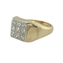 Load image into Gallery viewer, Add brilliance and bold style to your collection with this pre-owned 9ct yellow gold and cubic zirconia signet ring—perfect for making a statement with classic sparkle.

Design: The ring features an 11mm high front set with nine cubic zirconia stones arranged in a square, offering a bold, eye-catching look with refined symmetry.
Material: Made from 9-carat yellow gold, the polished finish enhances the brightness of the stones and adds a warm, luxurious glow.

