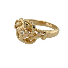 Load image into Gallery viewer, Add vintage charm and symbolic elegance to your collection with this pre-owned 18ct yellow gold and diamond set knot ring—perfect for timeless beauty with meaningful detail.

Design: The ring features an 11mm high knot-style front with intricate vintage-inspired patterning and a central diamond for added brilliance and depth.
Material: Made from 18-carat yellow gold, the polished finish enhances the detailed design and offers a rich, luxurious glow.

