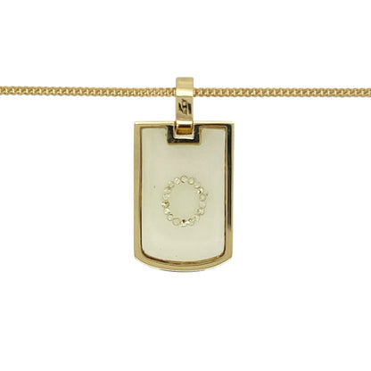Add a touch of luxury and unique craftsmanship to your collection with this pre-owned 18ct yellow gold and diamond set glass case tag pendant on an 18" curb chain—perfect for modern elegance with a hint of intrigue.

Design: The pendant measures 2.6cm long including the bail and features a tag-style shape with a glass-front case and delicate diamond accents, blending contemporary styling with refined sparkle.
