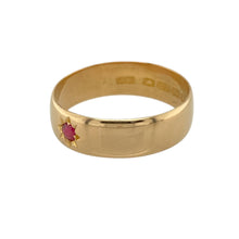 Load image into Gallery viewer, Add rich colour and traditional elegance to your collection with this pre-owned 22ct yellow gold and ruby set band ring—perfect for timeless style with a luxurious touch.

Design: The ring features a 3mm round ruby set at the centre of a 6mm wide band, offering a bold yet refined design with a pop of deep red colour.
Material: Made from 22-carat yellow gold, the highly polished finish enhances the deep, warm tone of the gold and contrasts beautifully with the vibrant ruby.

