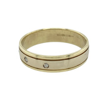 Load image into Gallery viewer, Add contemporary elegance and two-tone detail to your collection with this pre-owned 9ct yellow and white gold diamond set band ring—perfect for refined style with a subtle sparkle.

Design: The 6mm wide band features a central white gold panel set with sparkling diamonds, bordered by polished yellow gold edges for a sleek and modern contrast.
Material: Made from 9-carat yellow and white gold, the polished finish enhances the brilliance of the diamonds and the richness of the gold tones.

