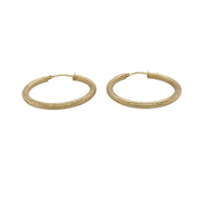 Load image into Gallery viewer, Add subtle texture and contemporary style to your collection with these pre-owned 9ct yellow gold brushed effect textured hoop creole earrings—perfect for understated elegance with a modern finish.

Design: Each earring features a classic creole hoop with a brushed effect texture, offering a soft matte finish that contrasts beautifully with the warm gold tone.
Material: Made from 9-carat yellow gold, the brushed surface enhances the refined look while maintaining a timeless aesthetic.

