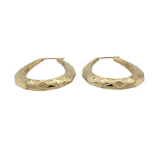 Load image into Gallery viewer, Add texture and timeless elegance to your collection with these pre-owned 9ct yellow gold patterned oval creole earrings—perfect for everyday sophistication with classic detail.

Design: Each earring features an oval creole shape with intricate patterning that adds depth and visual interest to the polished gold surface.
Material: Made from 9-carat yellow gold, the combination of smooth and textured finishes enhances the refined and radiant appearance.

