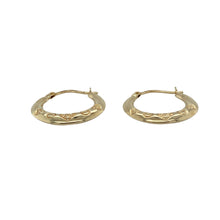 Load image into Gallery viewer, Add delicate charm and subtle shine to your collection with these pre-owned 9ct yellow gold heart patterned hoop creole earrings—perfect for light, everyday elegance with a romantic touch.

Design: Each earring features a classic hoop creole shape adorned with a fine heart pattern, blending timeless style with sweet detail.
Material: Made from 9-carat yellow gold, the polished finish enhances the decorative design with a warm, radiant glow.

