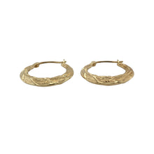 Load image into Gallery viewer, Add natural detail and graceful shine to your collection with these pre-owned 9ct yellow gold leaf patterned hoop creole earrings—perfect for elegant styling with a touch of nature-inspired charm.

Design: Each earring features a classic creole hoop shape adorned with an intricate leaf pattern, offering delicate texture and organic beauty.
Material: Made from 9-carat yellow gold, the polished and textured finish enhances the fine detailing with a soft, golden glow.

