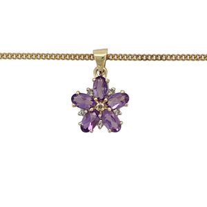Bring vibrant colour and floral elegance to your jewellery collection with this pre-owned 9ct yellow gold diamond and amethyst flower pendant on an 18" curb chain—a radiant piece full of charm and graceful detail.

Design: The 1.8cm long pendant, including the bail, features a flower motif with six marquise-cut amethysts measuring 5mm by 3mm, accented by a central diamond for added sparkle.

