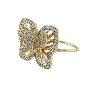 Bring whimsical sparkle and soft colour to your jewellery collection with this pre-owned 9ct yellow gold cubic zirconia butterfly ring—a playful yet elegant piece with delicate detail and graceful charm.

Design: The 17mm high butterfly design features a mix of white and light purple cubic zirconia stones, creating a lively, shimmering effect with a touch of colour.
Material: Made from 9-carat yellow gold, the warm-toned band provides a rich contrast to the cool sparkle of the cubic zirconia.
