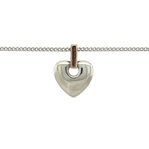 Bring heartfelt sentiment and Welsh heritage to your jewellery collection with this pre-owned Clogau heart pendant—crafted in 925 silver with 9ct Clogau rose gold on an adjustable curb chain for a meaningful and elegant finish.

Design: The 1.5cm long heart pendant, including the bail, features the Welsh word Cariad—meaning ‘love’—engraved on the bail, blending emotion with timeless design.
