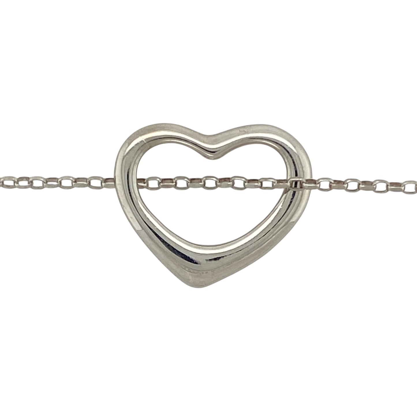 Bring modern simplicity and elegant sentiment to your jewellery collection with this pre-owned 9ct white gold open heart pendant on a 20" belcher chain—a timeless piece with soft curves and a contemporary finish.

Design: The pendant measures 18mm by 21mm and features an open heart shape with smooth lines, offering a clean and graceful silhouette.
Material: Made from 9-carat white gold, the polished finish gives a cool-toned shine that enhances the pendant’s modern appeal.

