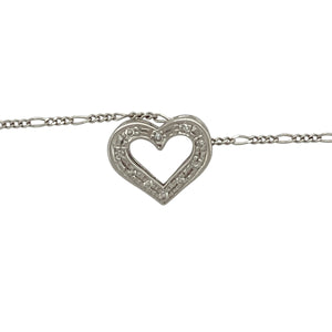 Bring delicate sparkle and heartfelt elegance to your jewellery collection with this pre-owned 9ct white gold diamond open heart pendant on an 18" Figaro chain—a timeless piece with graceful charm and romantic detail.

Design: The 10mm by 12mm open heart pendant is adorned with sparkling diamonds along one side, creating a soft asymmetry that adds depth and brilliance.
Material: Made from 9-carat white gold, the polished finish provides a cool, refined backdrop that enhances the sparkle of the diamonds.
