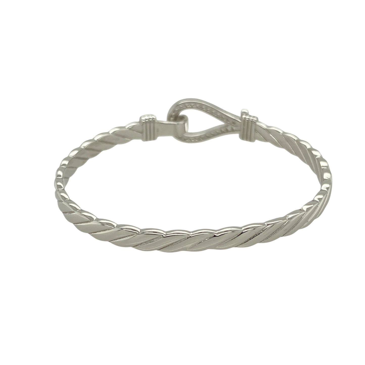 Bring playful sparkle and classic charm to a young jewellery collection with this new solid 925 silver and cubic zirconia children's horseshoe bangle—a sweet and symbolic piece designed with timeless appeal.

Design: The 11mm high front features a horseshoe motif adorned with shimmering cubic zirconia stones, symbolising luck and adding a touch of sparkle.
Material: Made from solid 925 sterling silver, the polished finish offers a bright, smooth shine that enhances the brilliance of the stones.
