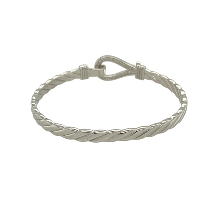 Bring playful sparkle and classic charm to a young jewellery collection with this new solid 925 silver and cubic zirconia children's horseshoe bangle—a sweet and symbolic piece designed with timeless appeal.

Design: The 11mm high front features a horseshoe motif adorned with shimmering cubic zirconia stones, symbolising luck and adding a touch of sparkle.
Material: Made from solid 925 sterling silver, the polished finish offers a bright, smooth shine that enhances the brilliance of the stones.
