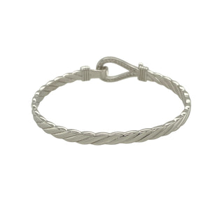 Bring playful sparkle and classic charm to a young jewellery collection with this new solid 925 silver and cubic zirconia children's horseshoe bangle—a sweet and symbolic piece designed with timeless appeal.

Design: The 11mm high front features a horseshoe motif adorned with shimmering cubic zirconia stones, symbolising luck and adding a touch of sparkle.
Material: Made from solid 925 sterling silver, the polished finish offers a bright, smooth shine that enhances the brilliance of the stones.

