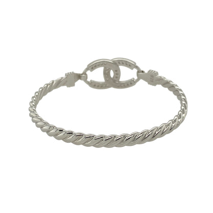 Bring classic charm and a touch of sparkle to a young jewellery collection with this new solid 925 silver and cubic zirconia children's horseshoe bangle—a meaningful piece designed with timeless appeal and playful elegance.

Design: The 12mm high front features a detailed horseshoe motif set with cubic zirconia stones, symbolising good luck and adding subtle brilliance.
