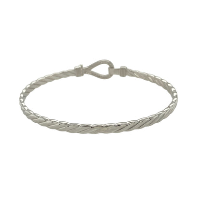 Bring bold shine and symbolic elegance to your jewellery collection with this new solid 925 silver and cubic zirconia horseshoe bangle—a timeless piece that blends luck, sparkle, and polished style.

Design: The 11mm high front features a classic horseshoe motif adorned with shimmering cubic zirconia stones, symbolising good fortune and adding eye-catching brilliance.
Material: Made from solid 925 sterling silver, the high-polish finish enhances the smooth shine and sparkle of the stones.
