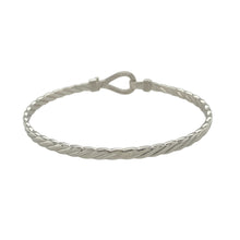 Load image into Gallery viewer, Bring bold shine and symbolic elegance to your jewellery collection with this new solid 925 silver and cubic zirconia horseshoe bangle—a timeless piece that blends luck, sparkle, and polished style.

Design: The 11mm high front features a classic horseshoe motif adorned with shimmering cubic zirconia stones, symbolising good fortune and adding eye-catching brilliance.
Material: Made from solid 925 sterling silver, the high-polish finish enhances the smooth shine and sparkle of the stones.

