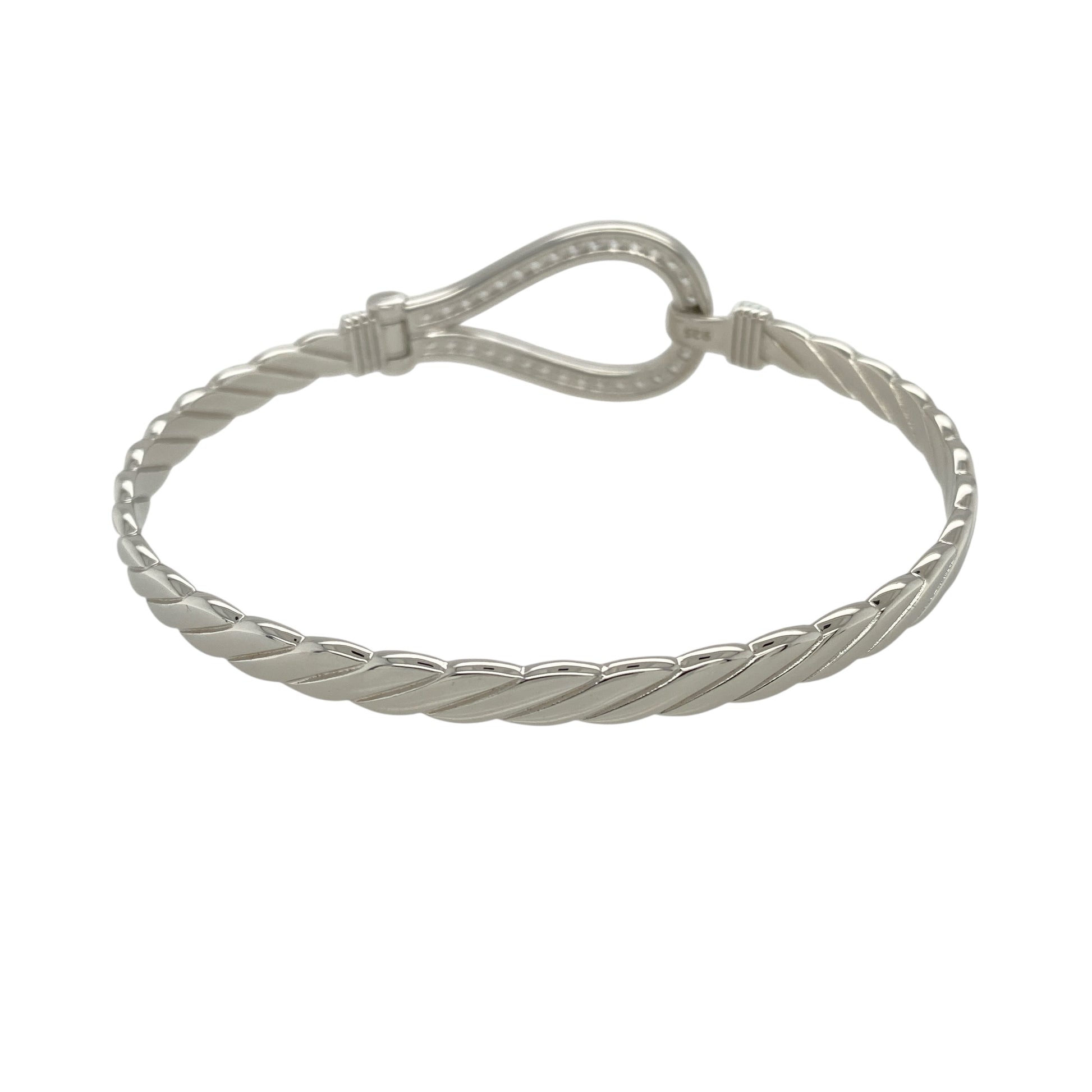 Bring bold brilliance and timeless symbolism to your jewellery collection with this new solid 925 silver and cubic zirconia horseshoe bangle—a statement piece that combines strength, style, and a touch of luck.

Design: The 20mm high front features a prominent horseshoe motif encrusted with sparkling cubic zirconia stones, creating a radiant symbol of good fortune and standout elegance.
