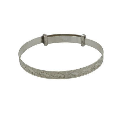Bring playful charm and gentle elegance to a little one’s jewellery collection with this new 925 silver dolphin patterned baby expander bangle—a sweet and symbolic keepsake with a touch of ocean-inspired joy.

Design: The 4mm wide bangle features a delightful dolphin pattern etched along the band, symbolising playfulness, protection, and harmony.
Material: Made from solid 925 sterling silver, the polished finish adds a bright, smooth shine that highlights the detailed design.

