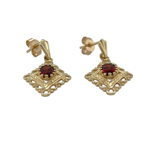 Bring rich colour and ornate detail to your collection with these pre-owned 9ct yellow gold and garnet fancy drop earrings—elegant and timeless with a touch of vintage flair.

Design: Each earring features a 6mm by 4mm oval-cut garnet, set within an intricate drop design that adds graceful movement and charm.
Material: Made from 9-carat yellow gold, the warm setting enhances the deep red tones of the garnets for a striking contrast.
