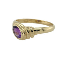 Load image into Gallery viewer, Bring rich colour and refined elegance to your collection with this pre-owned 9ct yellow gold and amethyst ring—a graceful piece with timeless appeal.

Design: This ring features a 6mm by 4mm oval-cut amethyst at the centre, offering a vibrant purple hue with classic styling.
Material: Made from 9-carat yellow gold, the polished finish complements the depth and brilliance of the amethyst.

