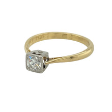 Load image into Gallery viewer, Bring refined brilliance and timeless elegance to your collection with this pre-owned 18ct yellow gold and platinum diamond solitaire ring—a classic design with a contemporary touch.

Design: This ring features a 0.25ct brilliant-cut diamond set in a square platinum setting, offering clean lines and modern sophistication.
Material: Made from 18-carat yellow gold with a platinum setting, the contrast of metals enhances the brightness of the diamond and adds a luxurious finish.

