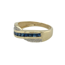 Load image into Gallery viewer, Bring flowing elegance and classic contrast to your collection with this pre-owned 9ct yellow gold diamond and sapphire crossover ring—a timeless design with graceful movement and sparkle.

Design: This ring features a stylish crossover design, with one band set with sapphires and the other with diamonds, creating a balanced and eye-catching look.
Material: Made from 9-carat yellow gold, the polished finish enhances the richness of the sapphires and the brilliance of the diamonds.

