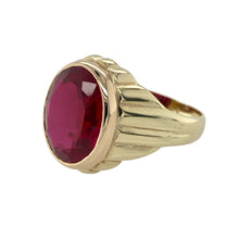 Load image into Gallery viewer, Bring bold style and classic presence to your collection with this pre-owned 9ct yellow gold and red stone signet ring—a statement piece with timeless appeal.

Design: This substantial ring features a 15mm by 13mm oval red stone, set in a traditional signet style for a strong and distinguished look.
Material: Made from 9-carat yellow gold, the polished finish enhances the rich hue of the stone and gives the piece a luxurious feel.

