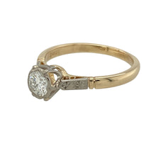 Load image into Gallery viewer, Bring timeless charm and refined sparkle to your collection with this pre-owned 18ct yellow gold and diamond vintage style solitaire ring—a classic design with elegant character.

Design: This ring features a brilliant-cut diamond set in a detailed white gold vintage-style setting, combining delicate craftsmanship with central sparkle.
Material: Made from 18-carat yellow gold with a white gold setting, the two-tone finish enhances the diamond’s brilliance and adds period-inspired elegance.

