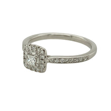 Load image into Gallery viewer, Add refined sparkle and contemporary elegance to your collection with this pre-owned 9ct white gold diamond square setting halo ring—a graceful design with a timeless silhouette.

Design: The 7mm high front features a square halo setting of diamonds surrounding a central stone, with additional diamonds half-set along the band for added brilliance.
Material: Made from 9-carat white gold, the polished finish enhances the icy sparkle of the diamonds and gives the ring a sleek, modern look.


