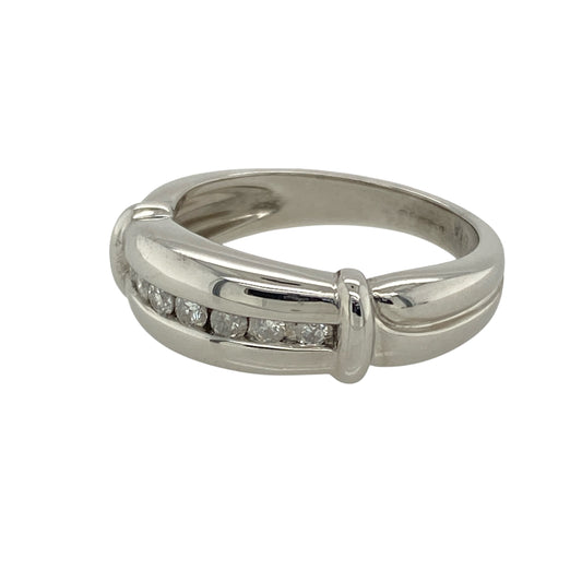 Add contemporary elegance and subtle sparkle to your collection with this pre-owned 9ct white gold diamond set band ring—a bold yet refined design with timeless appeal.

Design: The 6mm wide front features a sleek band with diamonds set along the centre, offering a clean line of brilliance and modern sophistication.
Material: Made from 9-carat white gold, the polished finish enhances the cool tone of the metal and highlights the sparkle of the diamond accents.
