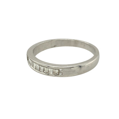 Add refined sparkle and timeless sophistication to your collection with this pre-owned 18ct white gold diamond set band ring—a sleek and elegant design with clean lines and brilliant detail.

Design: The 3mm wide front of the band is set with baguette-cut diamonds, offering a sophisticated and structured look with subtle sparkle.
Material: Made from 18-carat white gold, the polished finish enhances the crisp edges of the baguette stones and delivers a luxurious, contemporary shine.
