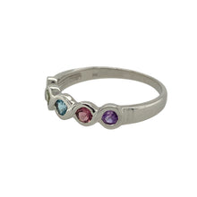 Load image into Gallery viewer, Add a playful splash of colour and elegant movement to your collection with this pre-owned 9ct white gold multi gemstone wave band ring—a vibrant design full of charm and personality.

Design: The 4mm wide front features a gentle wave pattern set with 2mm round gemstones in a rainbow of colours, including citrine, peridot, blue topaz, ruby, and amethyst.
Material: Made from 9-carat white gold, the polished finish enhances the sleek design and lets the bright gemstones shine.

