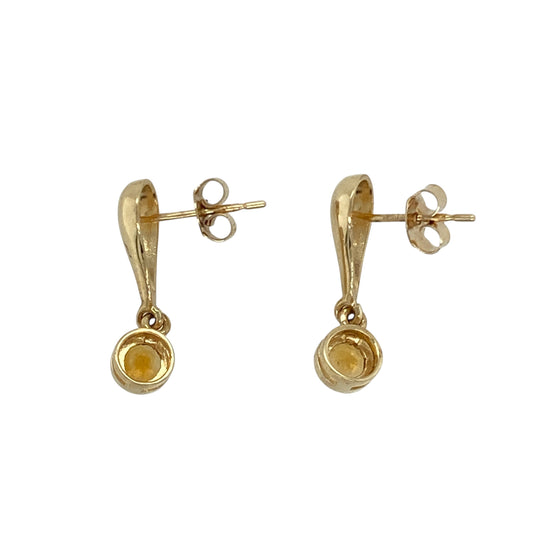 Add a touch of golden warmth and graceful movement to your look with these pre-owned 9ct yellow gold citrine set drop earrings—a vibrant and elegant design perfect for any occasion.

Design: Each earring features a 4mm round citrine stone, suspended in a simple drop setting that highlights the gemstone’s sunny hue and natural sparkle.
Material: Made from 9-carat yellow gold, the polished finish enhances the rich colour of the citrine and adds a luxurious glow.
