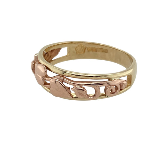 Embrace symbolic beauty and elegant design with this pre-owned 9ct yellow and rose gold Clogau Tree of Life band ring—a meaningful piece inspired by growth, strength, and connection.

Design: The 6mm wide front of the band features the iconic Tree of Life motif, intertwining yellow and rose gold in a flowing, organic pattern.
Material: Made from 9-carat yellow and rose gold, the polished finish enhances the warm contrast between the two tones and highlights the intricate detailing.
