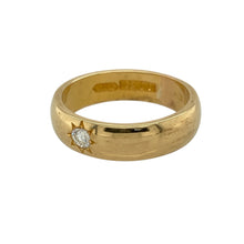 Load image into Gallery viewer, Add timeless richness and refined sparkle to your collection with this pre-owned 22ct yellow gold diamond set band ring—a luxurious piece with classic style and meaningful detail.

Design: The 6mm wide band features a single brilliant cut diamond set in a starburst pattern, adding a subtle yet elegant focal point.
Material: Made from high-purity 22-carat yellow gold, the polished finish enhances the deep golden hue and timeless appeal.

