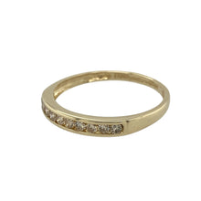 Load image into Gallery viewer, Add delicate sparkle and refined elegance to your collection with this pre-owned 9ct yellow gold diamond set band ring—a subtle yet radiant piece perfect for everyday wear.

Design: The 3mm wide front features a row of sparkling diamonds, offering classic brilliance in a slim and graceful profile.
Material: Made from 9-carat yellow gold, the polished finish enhances the warm tone and highlights the shimmer of the diamonds.

